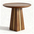 Round wooden table with striped base suitable for dining or workspace